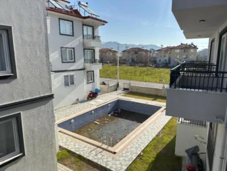 1 1 55M2 Brand New Apartment For Sale In A Complex With Pool Close To Ortaca Center.